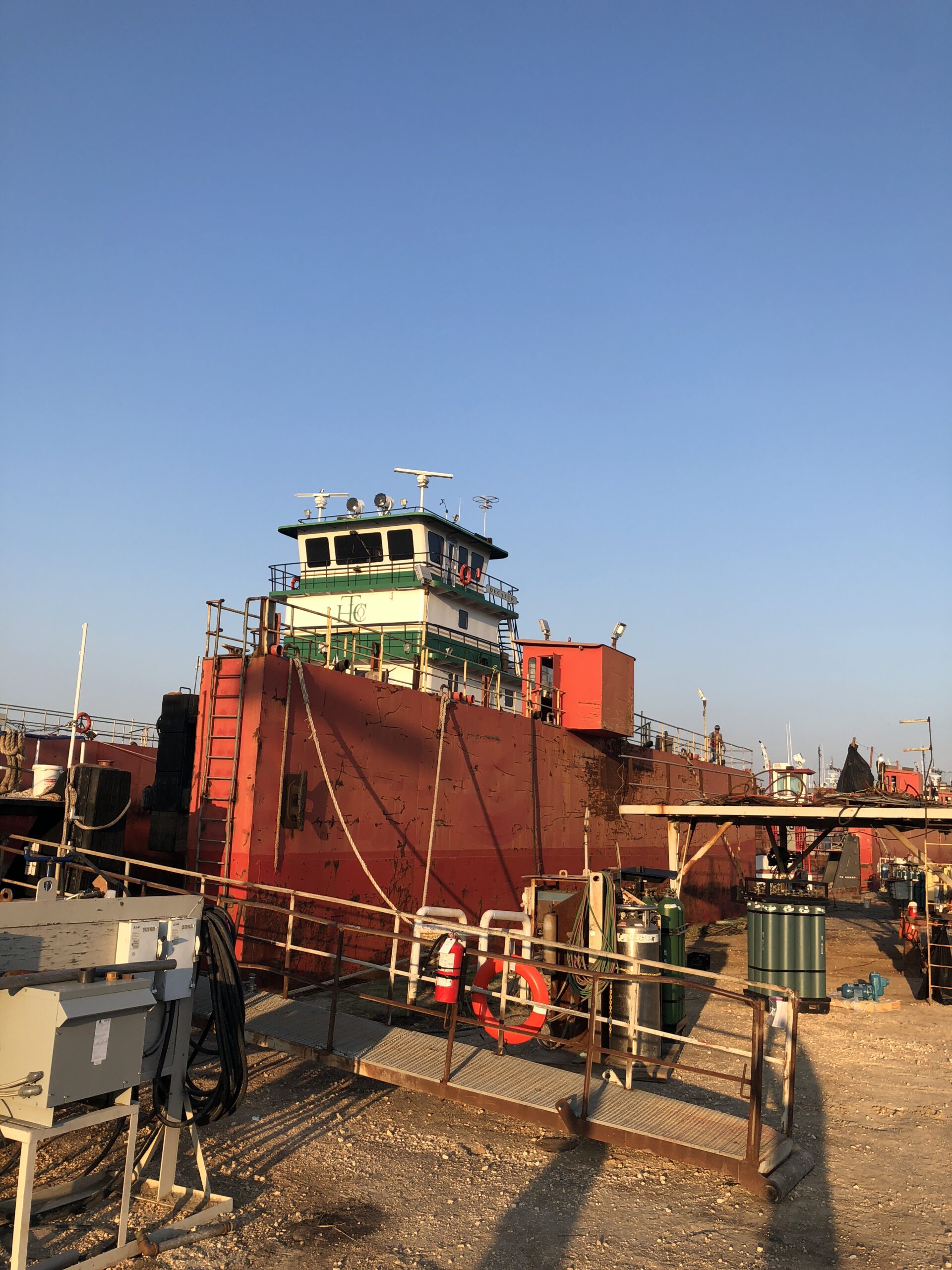 A large red boat sitting in the water.